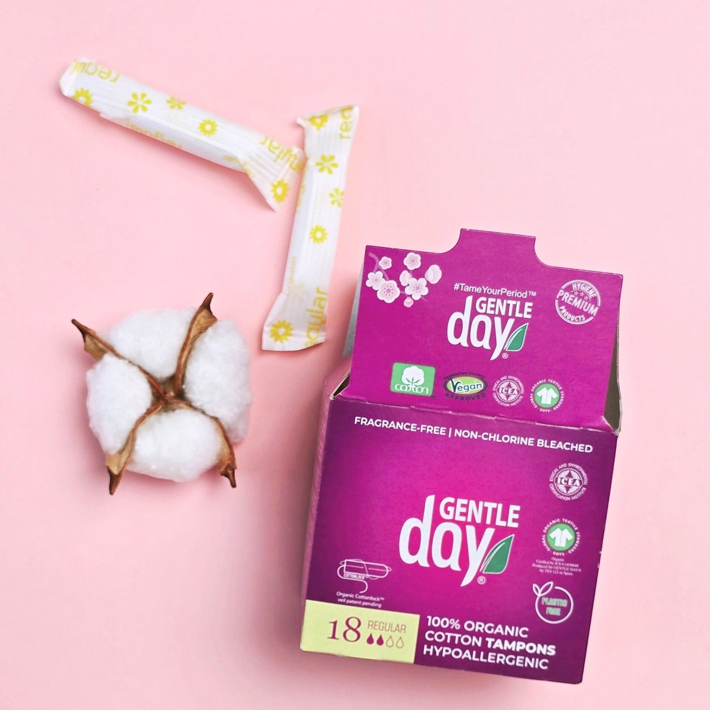 Gentle Day in South Africa organic cotton regular tampons with paper packaging and a raw cotton boll on pink background